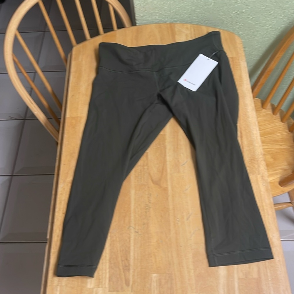 Brand new with tags Lululemon dark green, 21 inch crop legging